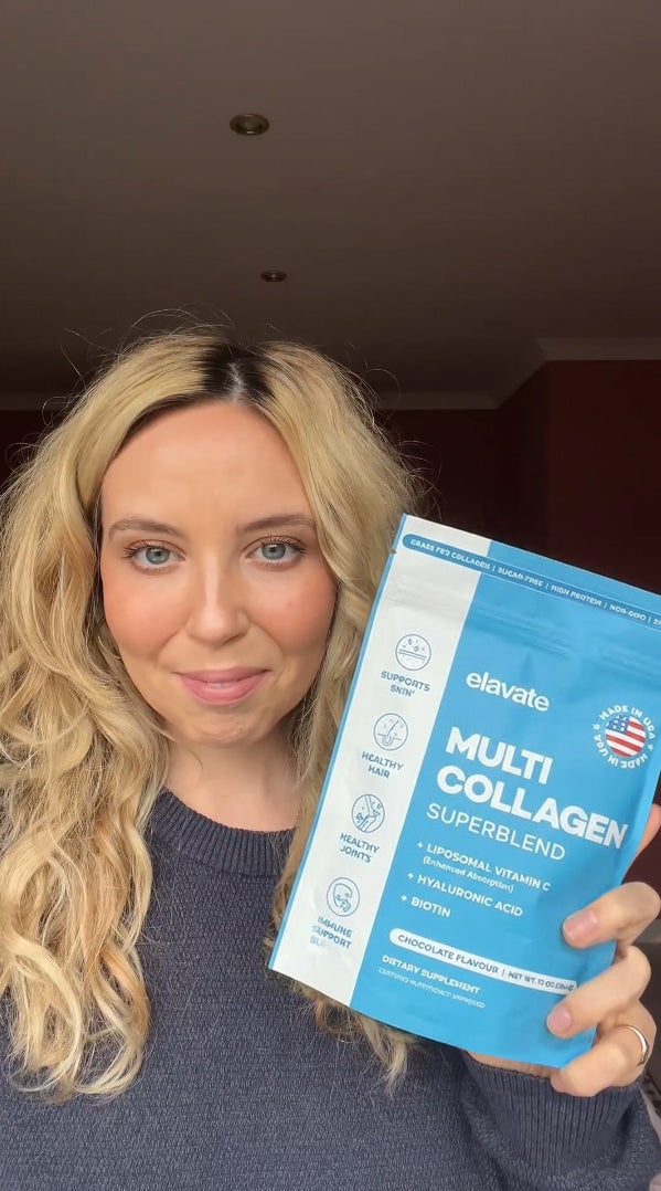 Smiling woman holding blue elavate Multi Collagen Superblend pouch, Chocolate flavour.